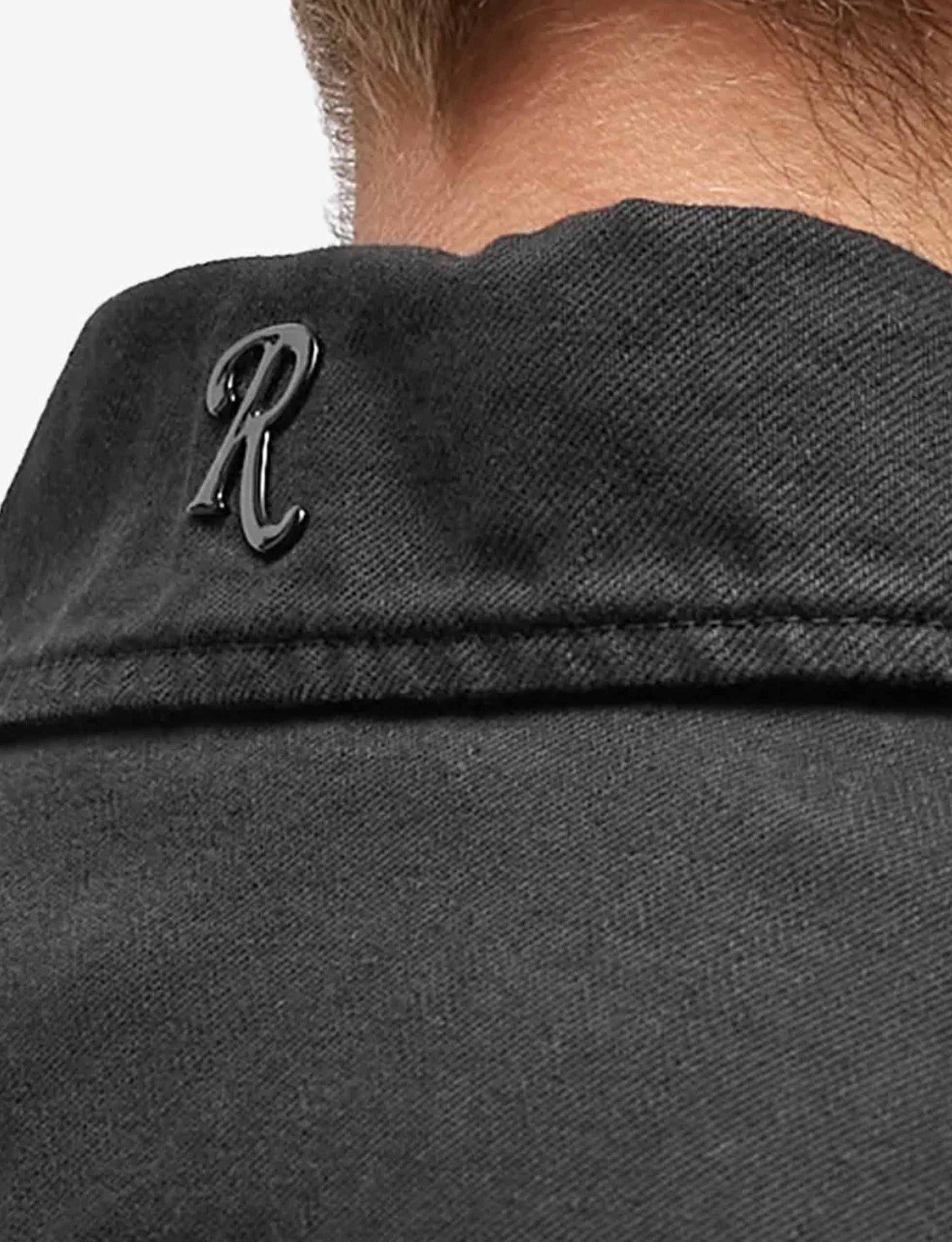 RAF SIMONS Oversized denim shirt with R pin in back